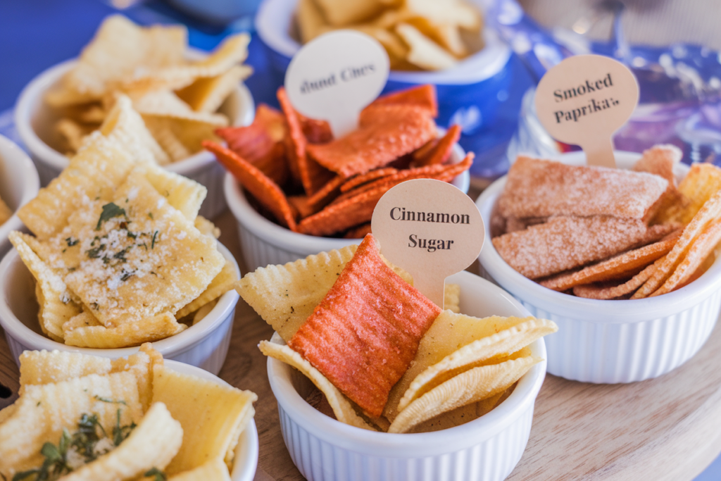 Bowls of pasta chips with different seasonings: Parmesan & Garlic, Smoked Paprika, and Cinnamon Sugar.