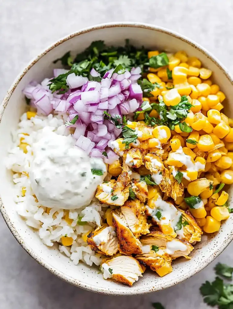 Assembling Street Corn Chicken Bowl